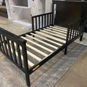 Black Wood Toddler Bed. Cosmetic damage to bottom left . Possible to paint to match.