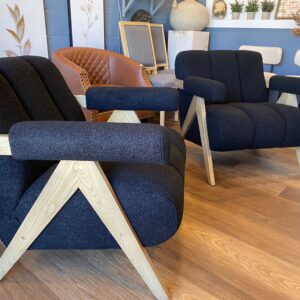 Set of two Chenice boucle armchairs in black on wood frame.