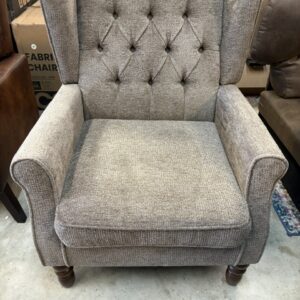 Button tufted, thick cushioned, taupe wingback armchair with wood legs. 27”D, 29”W, 18”seat, 36” back