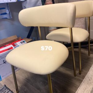 Two beige faux leather dining or side chairs on gold metal frame. 19x19x18”seat, 31”B