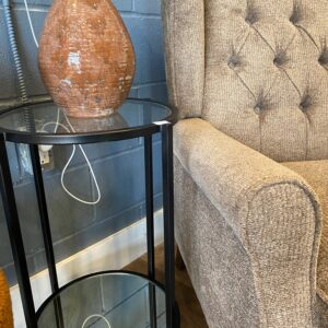Black metal side table with mirror bottom and glass top. 31”H, 19”D.